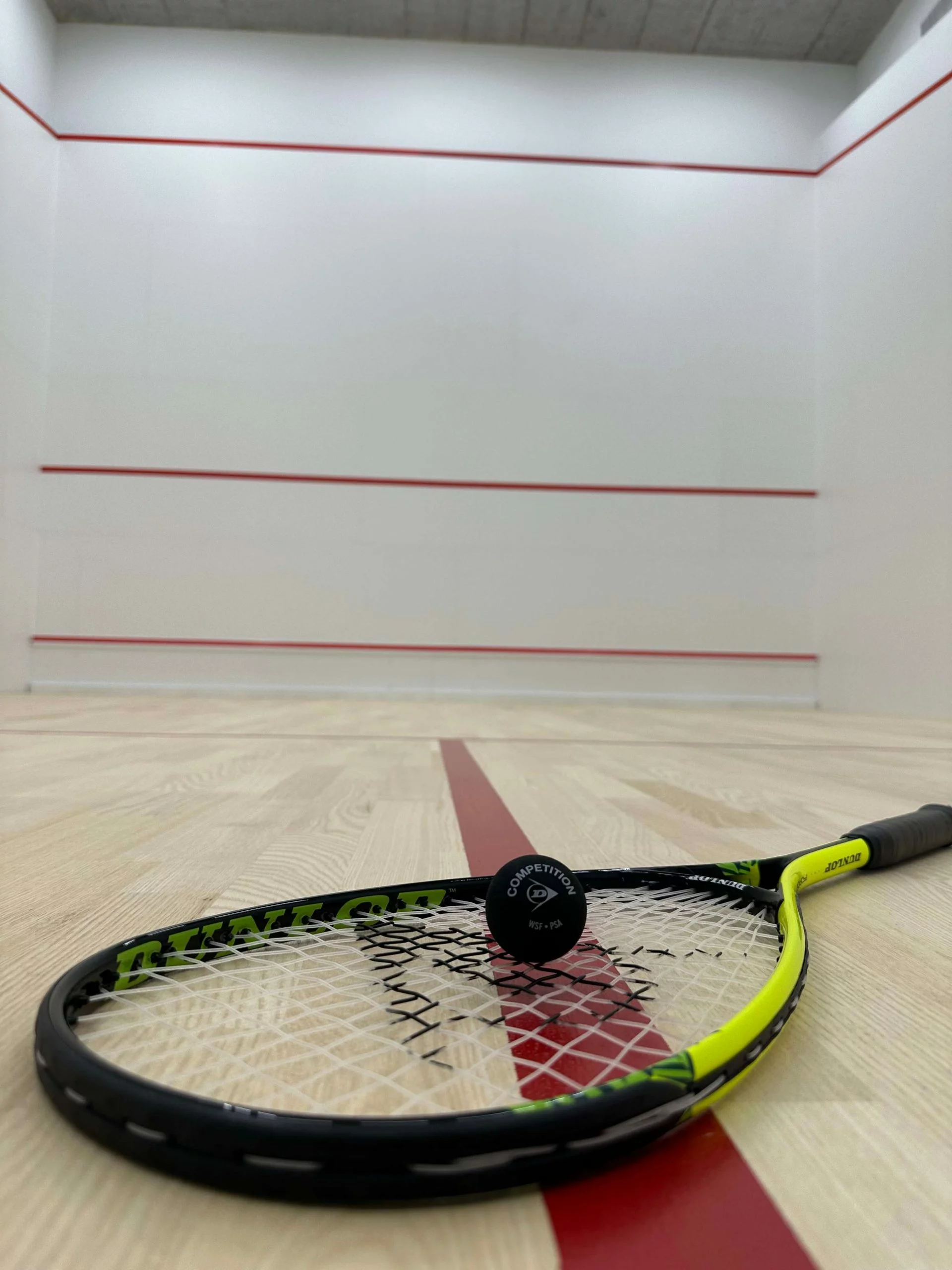 Squash court with racket and ball