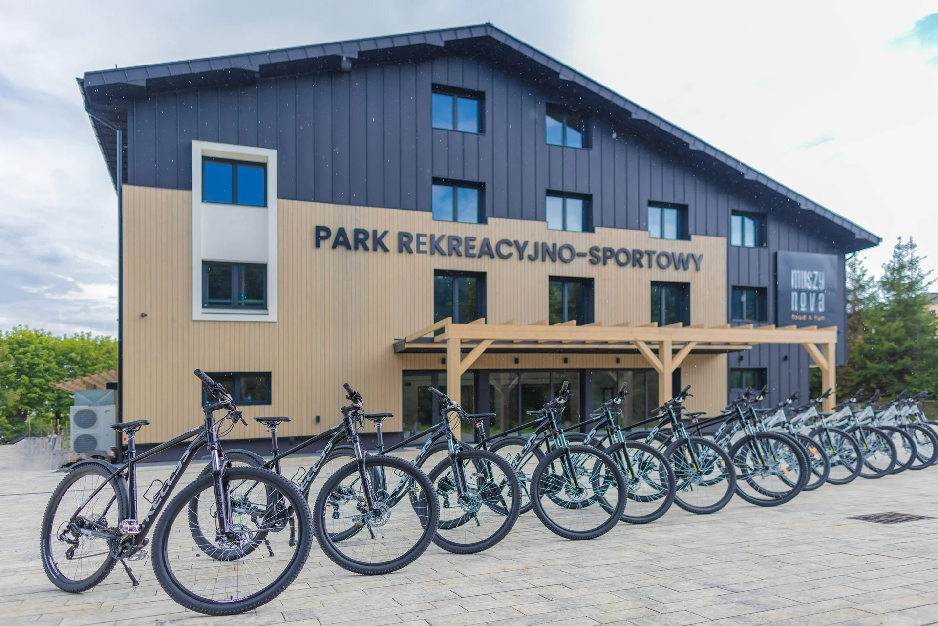 Many bikes in front of Muszynova Recreational and Sports Park in Muszyna